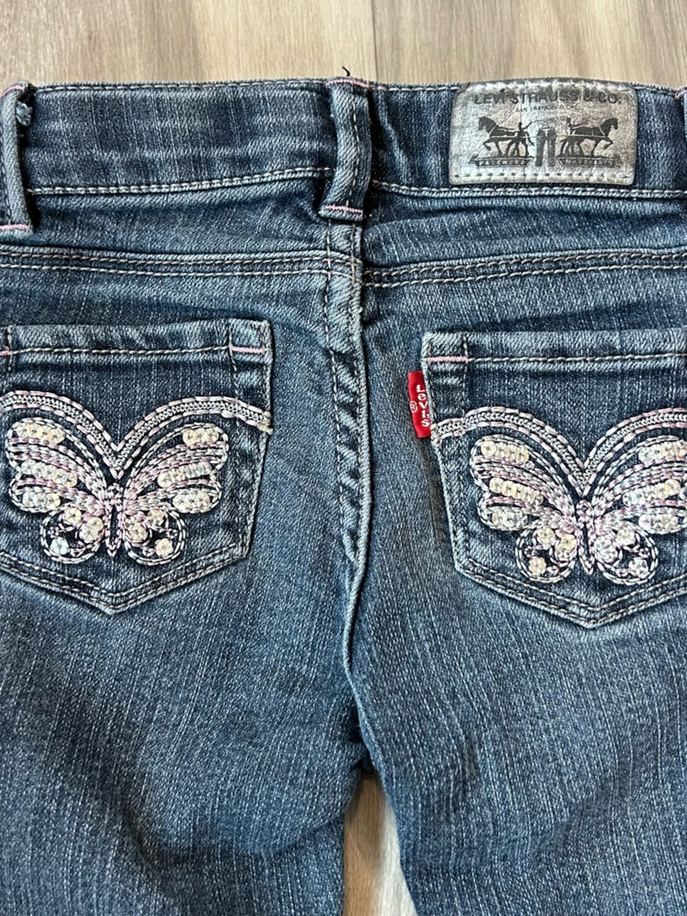 $5 Blue Denim Levi Jeans with Embellished Butterfly Pockets | 12M